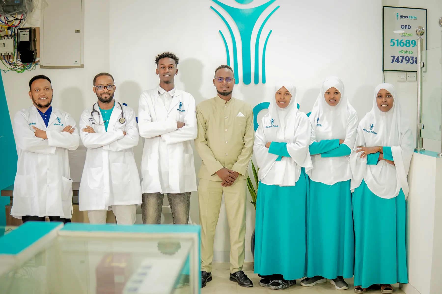 Members of the Hiraal Clinic care team standing together in the clinic reception