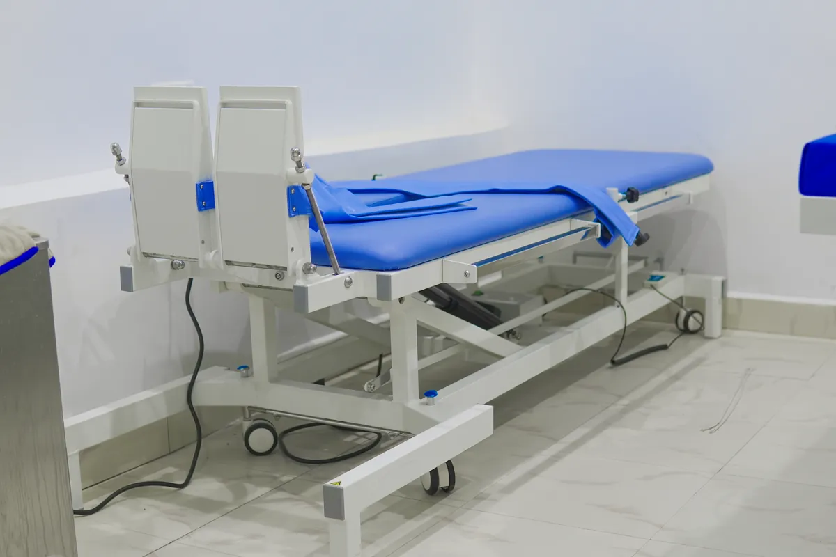 An adjustable treatment couch in the physiotherapy room